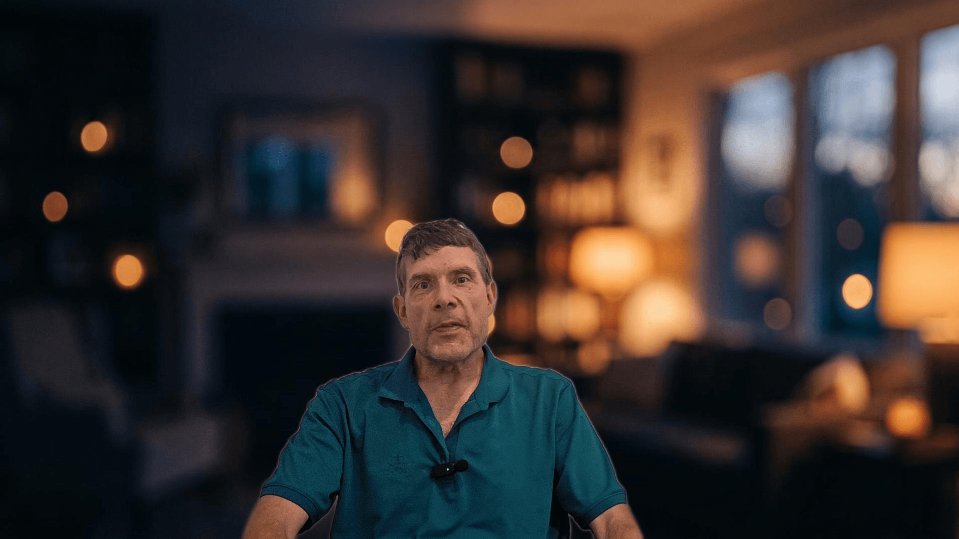 David speaking directly to camera about his CBD and Parkinson’s experience in a warmly lit room.